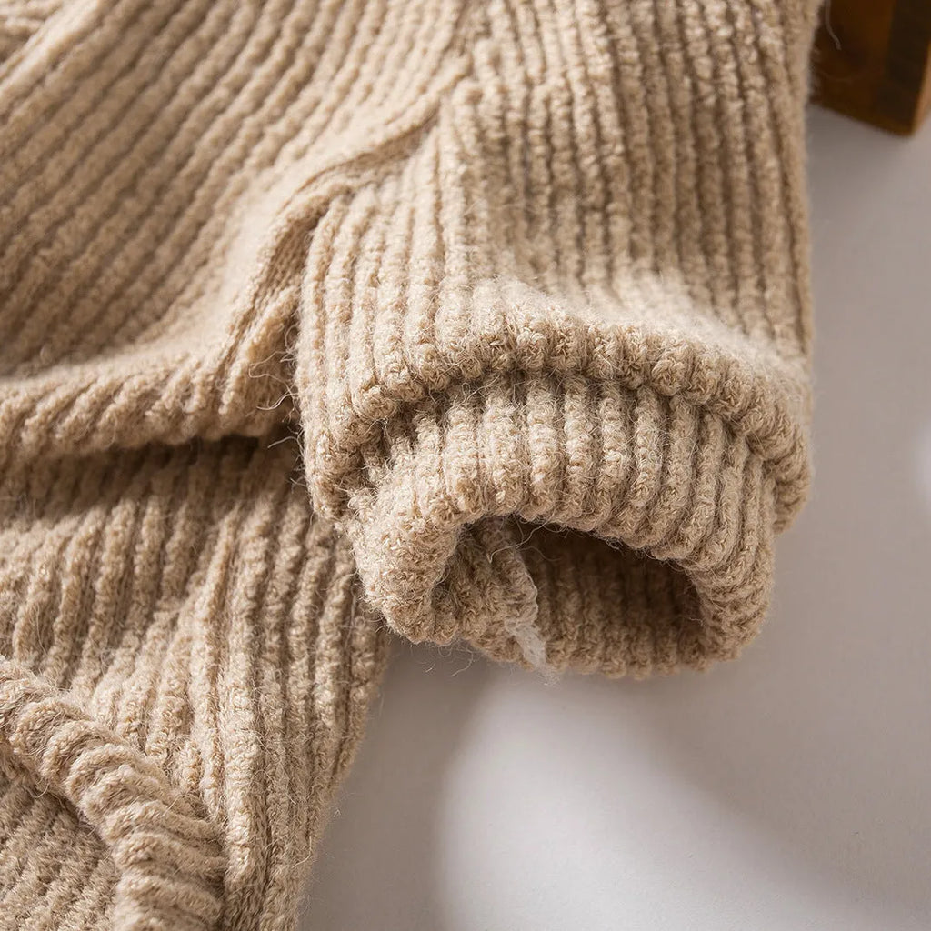Brown cloth pullover sweater on a small dog, showing casual design.