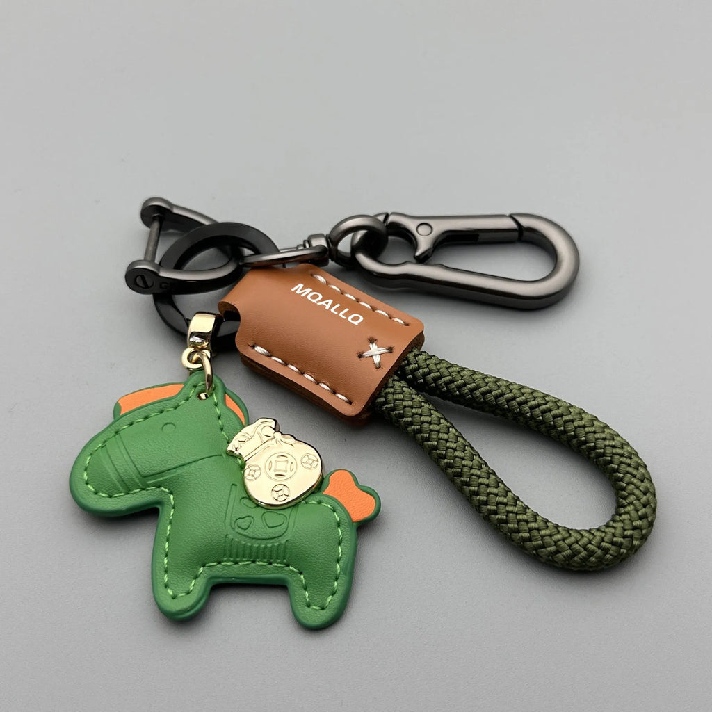 Handmade brown cowhide key ring pendant with a zinc alloy pony belt buckle and green flanelle rope.
