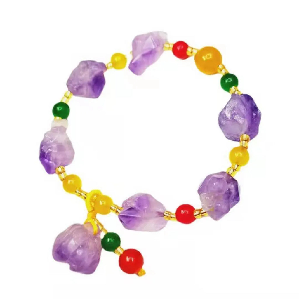 Purple natural shaped amethyst bead bracelet for women with a silver fu character charm.