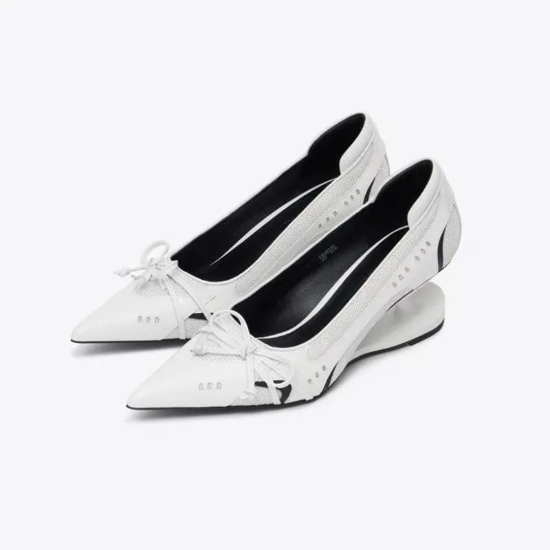 Black women's pointed toe Mary Jane shoes with a floating heel and slip-on design.
