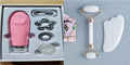 White jade double-headed roller and matching scraping board set on a flat surface.