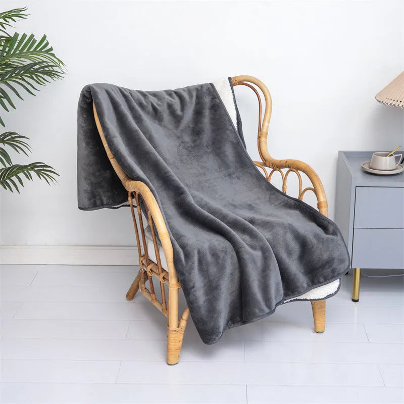 Lambswool waterproof dog blanket in grey, folded to show size and cloth texture.
