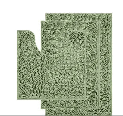 Chenille U-shaped three-piece bathroom carpet set in green beside a toilet.
