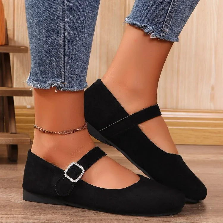 Women's solid black low-top canvas fisherman shoes with a flat rubber sole.