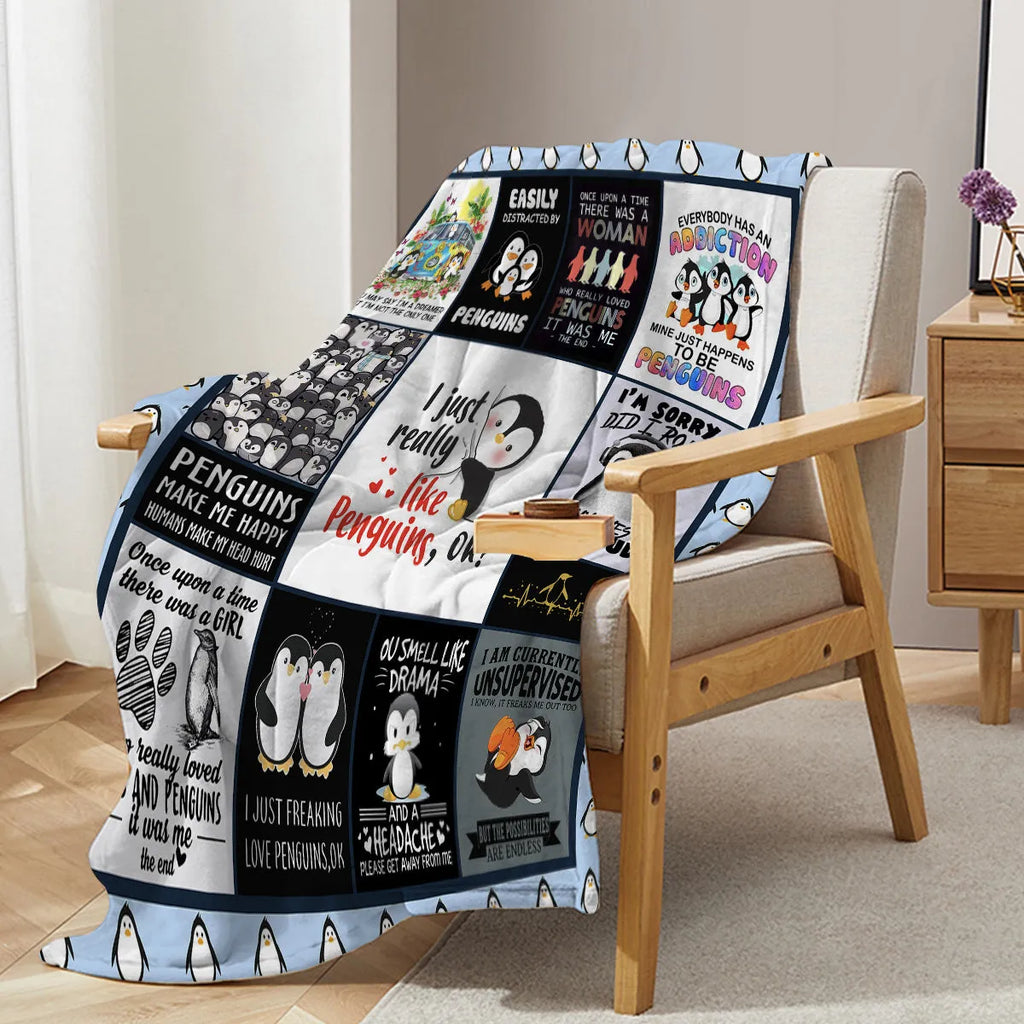 Multicoloured penguin flannel velvet throw blanket on sofa with hemmed edges