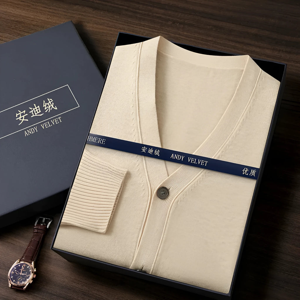 Man wearing a beige Andy velvet V-neck cardigan coat with long sleeves.