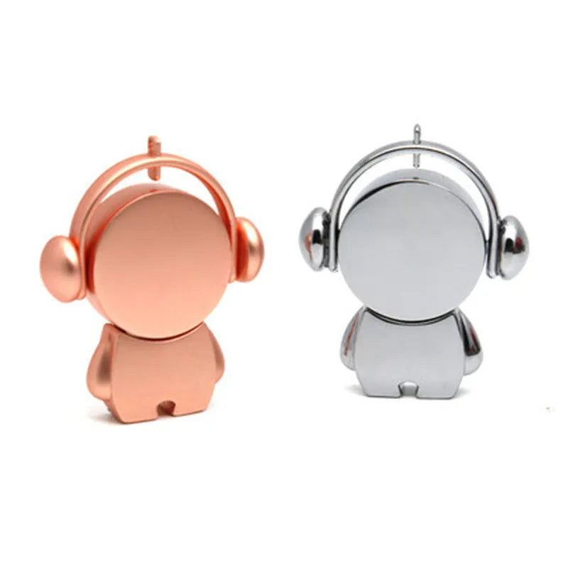 Silver and rose gold metal USB flash drives with musician cartoon designs showing compact dimensions