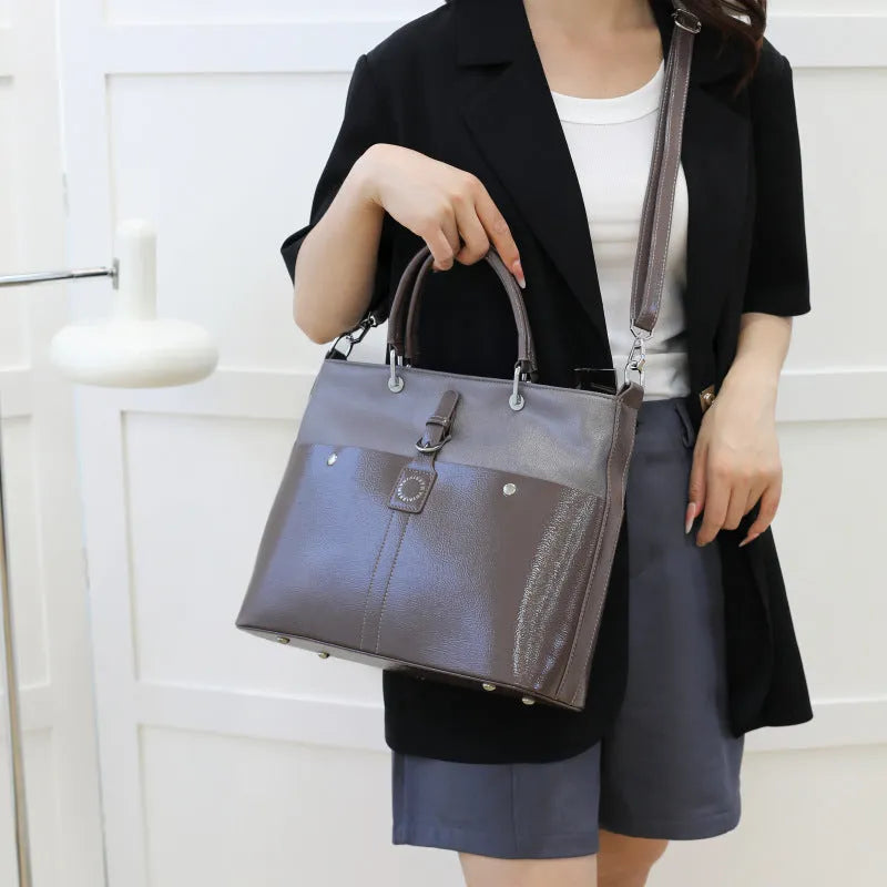 Soft PU shoulder messenger bag in horizontal square shape measuring 33cm by 28cm with sandwich pocket