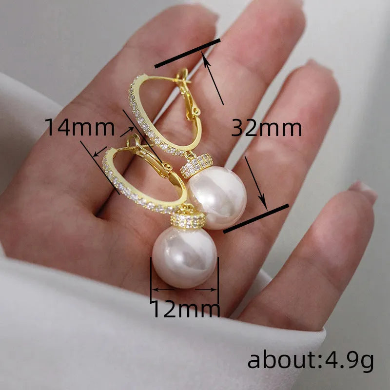 Yellow gold copper earrings with imitation pearl and inlaid zircon in geometric round shape