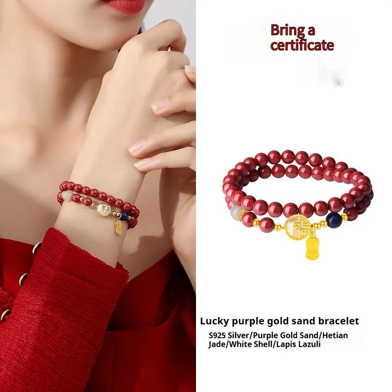 Close-up of a women's 925 sterling silver bracelet with a purple gold sandstone blessing charm and 6mm beads.