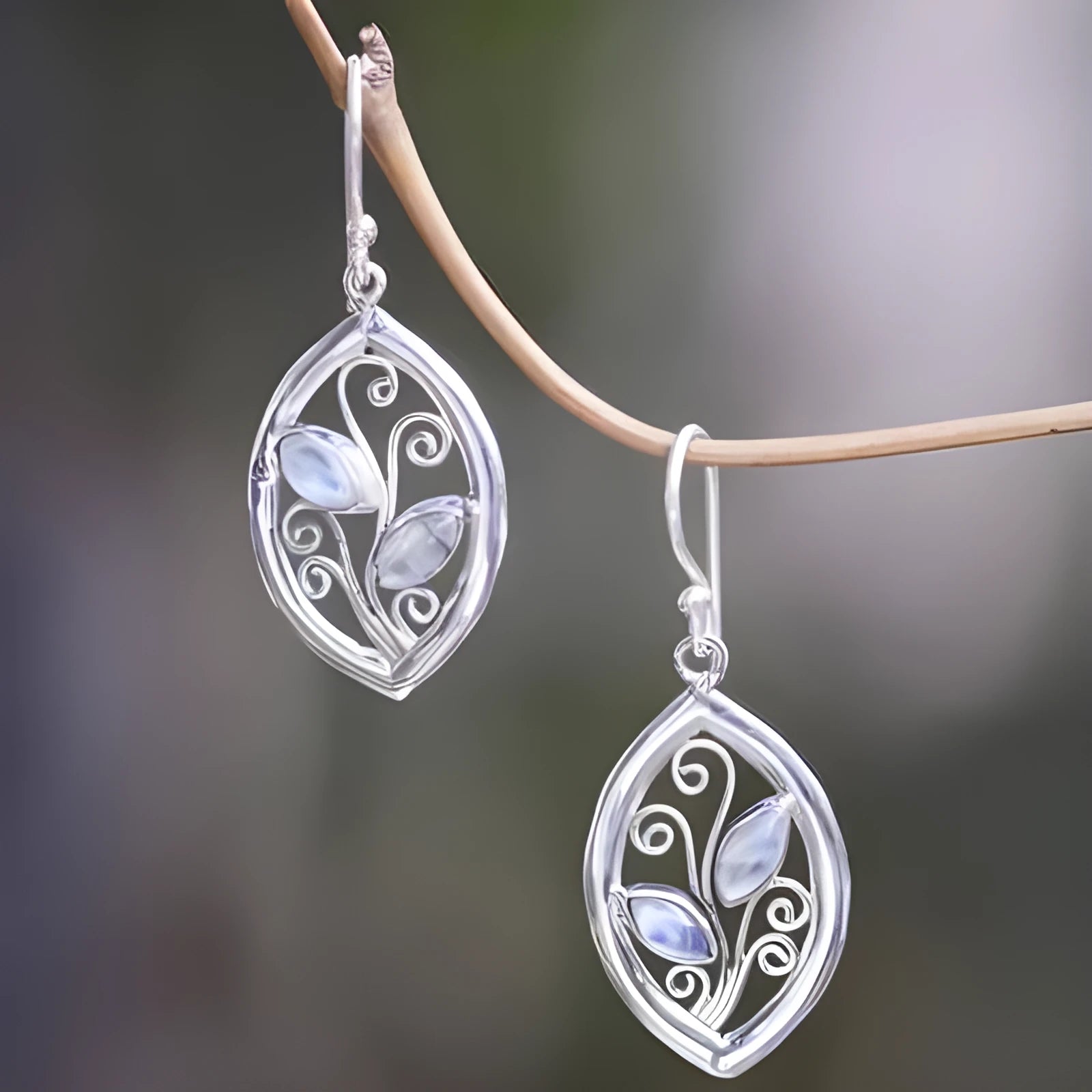 Silver colour leaf-shaped earrings with embedded colourful moonstones for women