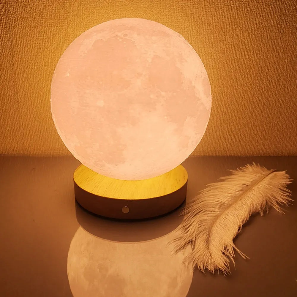 Rotating three-colour moon night lamp with wooden base in Nordic style, showing direct plug connection
