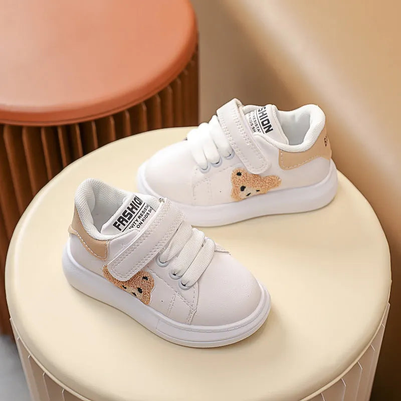 Baby Bear cartoon pattern kids sports sneakers in black, green, and khaki on a white background.