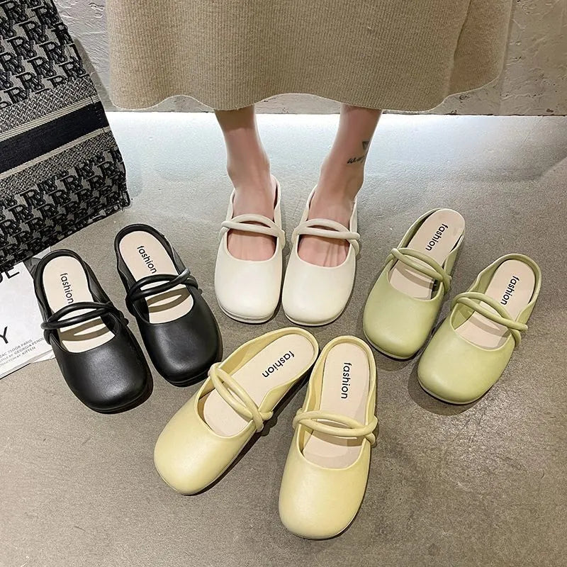 Ladies' plastic summer sandal with toe cap in green, shown from the side.
