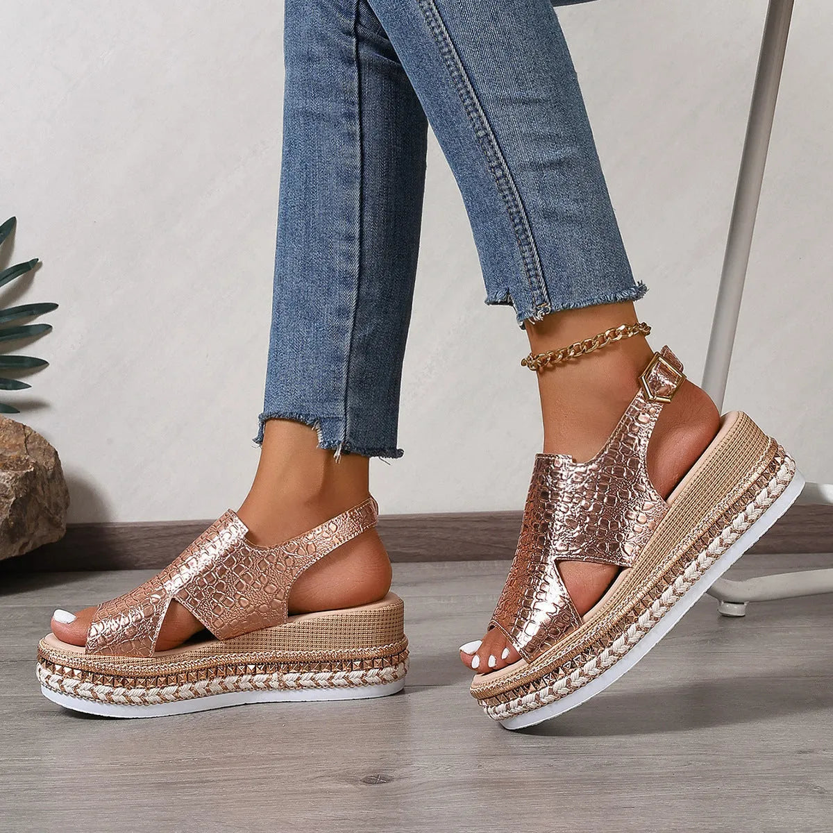 Gold women's Roman sandals with round toe and adjustable ankle buckle.