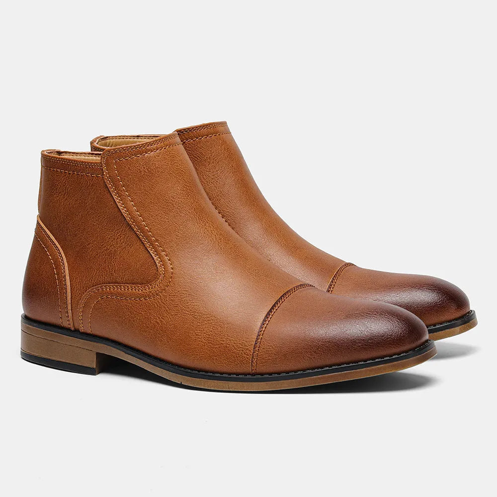 Men's brown Chelsea boot with a side zip, round toe, and low wooden heel on a white background.