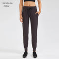 Women's high waist yoga pants in distilled coffee colour with drawstring waistband.