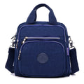 Ladies waterproof tear-proof nylon cross-body bag in beige, showing 25cm height and single shoulder strap