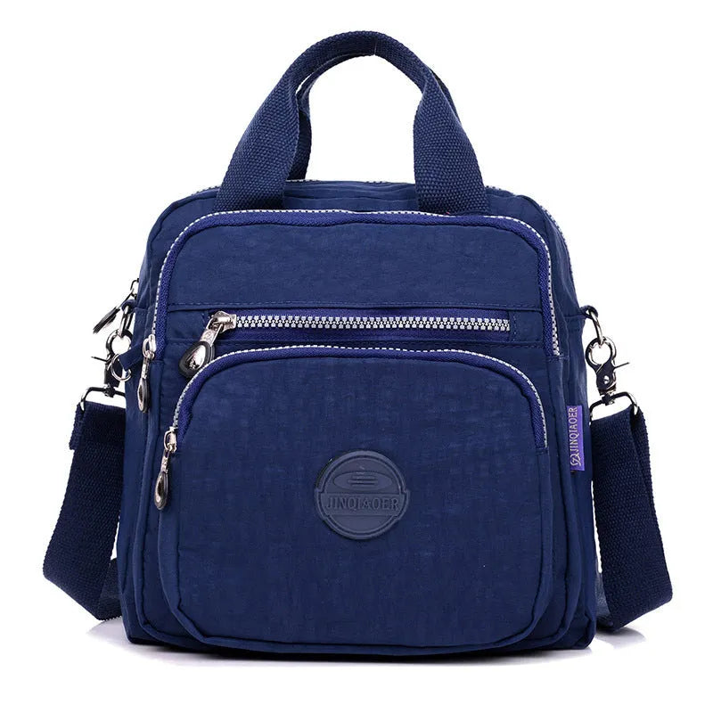 Ladies waterproof tear-proof nylon cross-body bag in beige, showing 25cm height and single shoulder strap