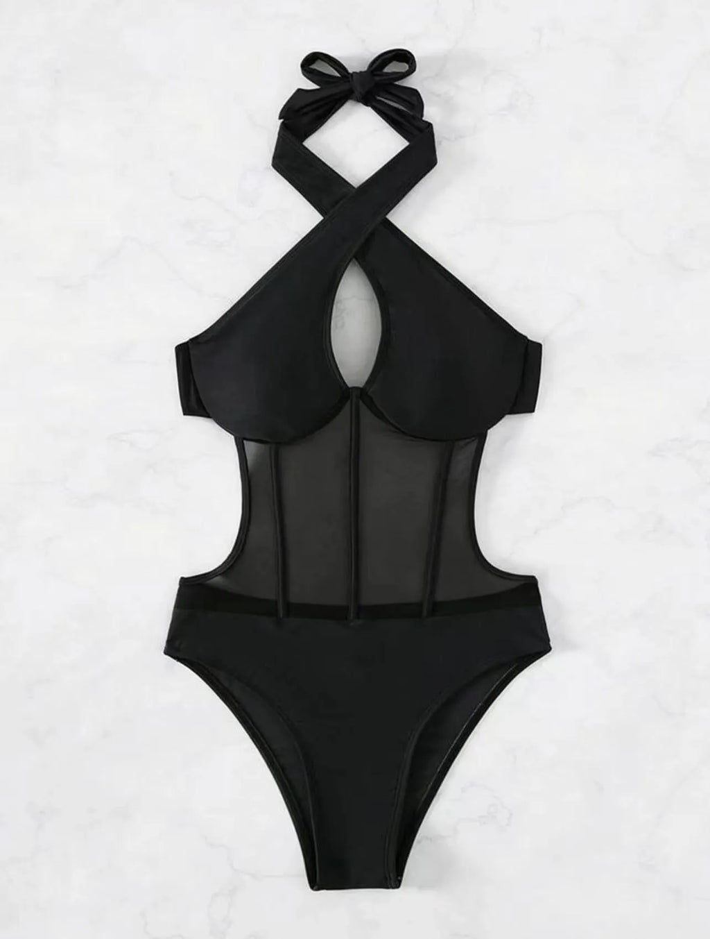 Women's black one-piece nylon swimsuit laid flat, showing its style and material.