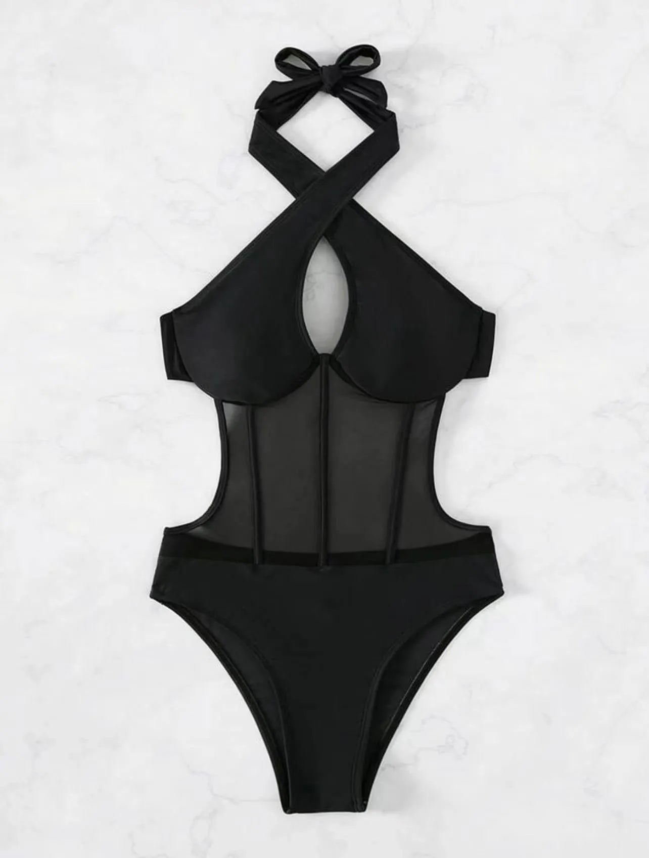 Women's black one-piece nylon swimsuit laid flat, showing its style and material.