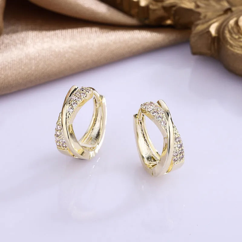 Geometric zircon earrings in 14K yellow colour crafted from copper