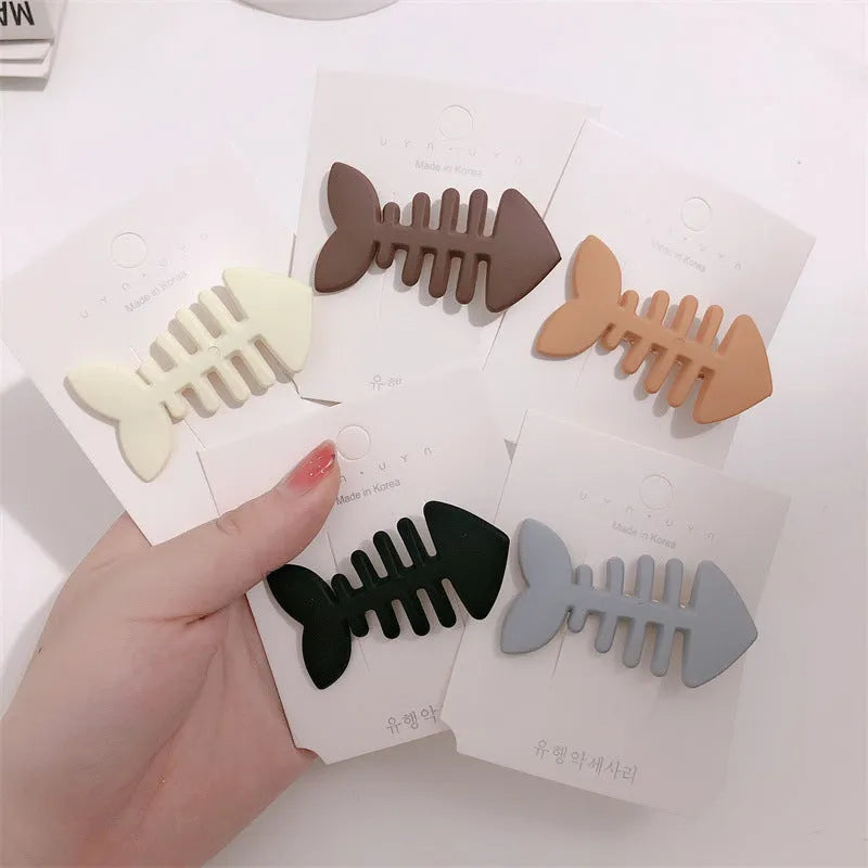 Minimalist fishbone pattern hair barrette with duckbill clip in neutral candy colour