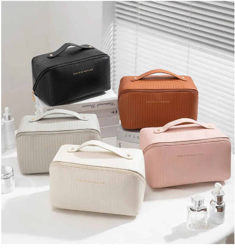 Large beige cubic PU leather makeup bag with vertical pattern, shown open.
