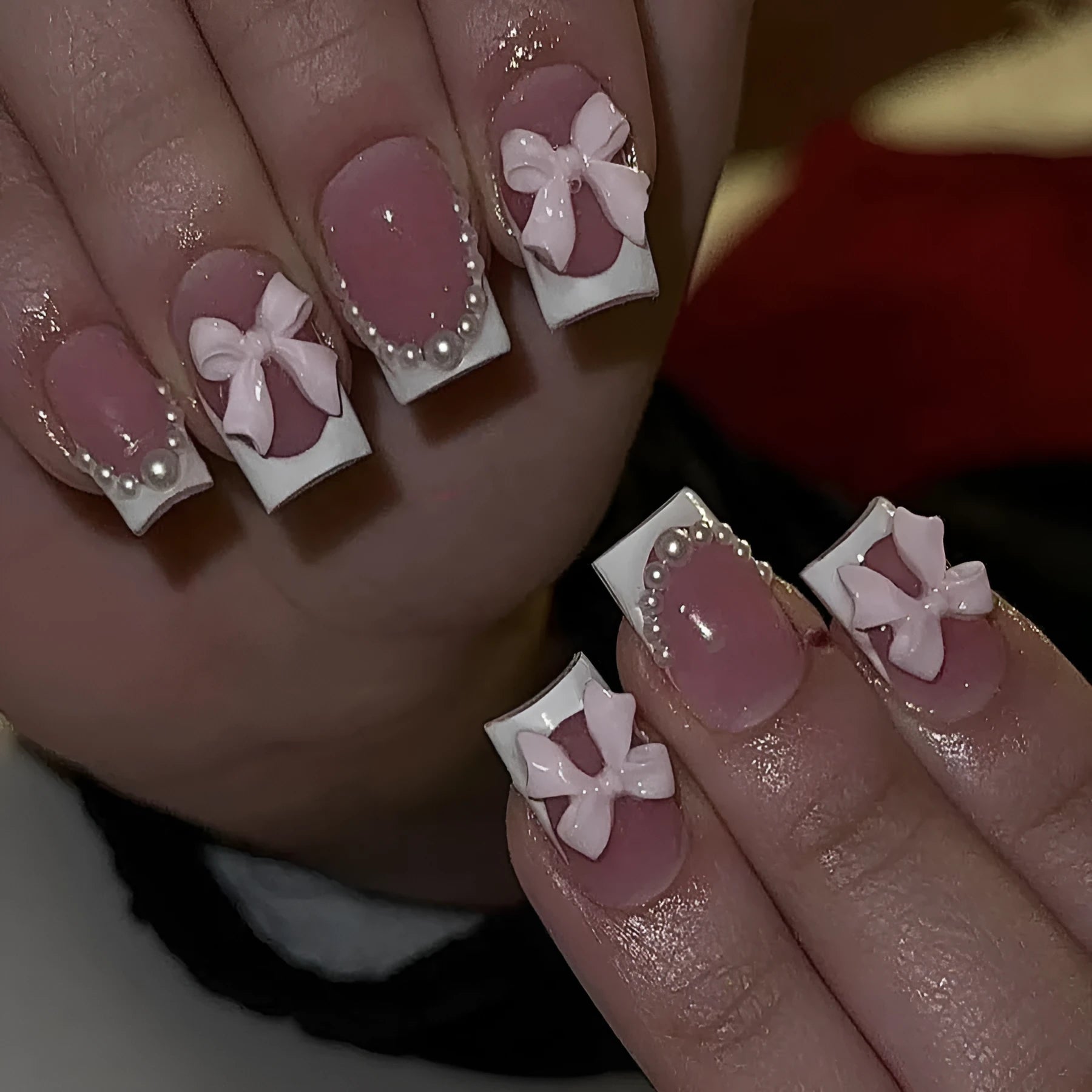 Set of 24 white French manicure false nails with bow and tulip designs, next to bottles of S274 glue and jelly glue.