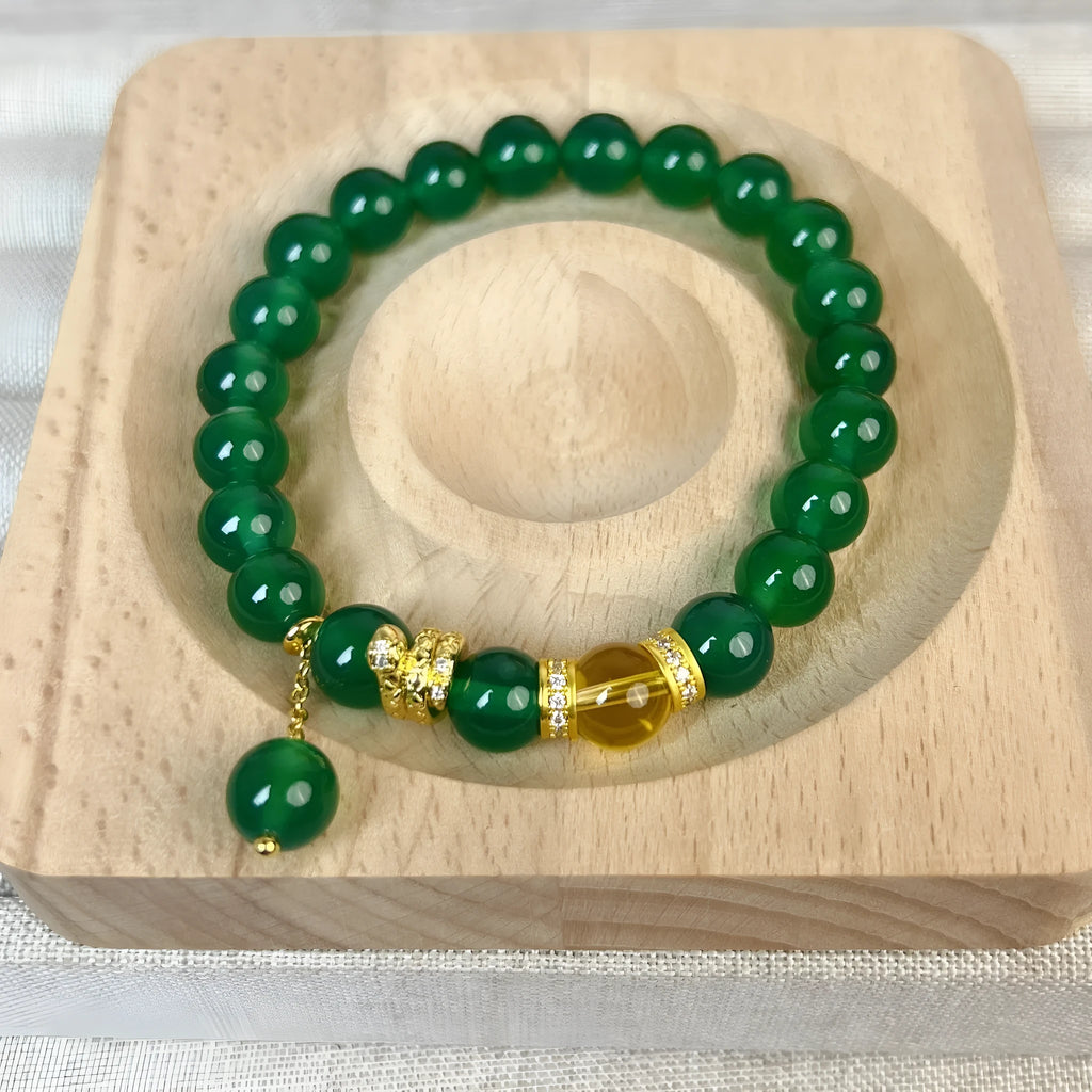 Natural green chalcedony and red agate wealth snake bracelet with copper geometric details.