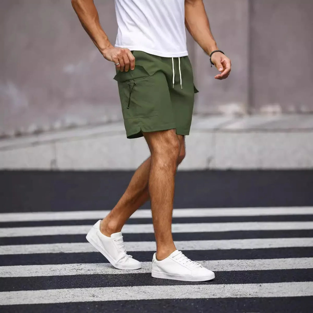 Men's loose fit workwear shorts in fluorescent green and army green colours with straight cut and fifth pants length