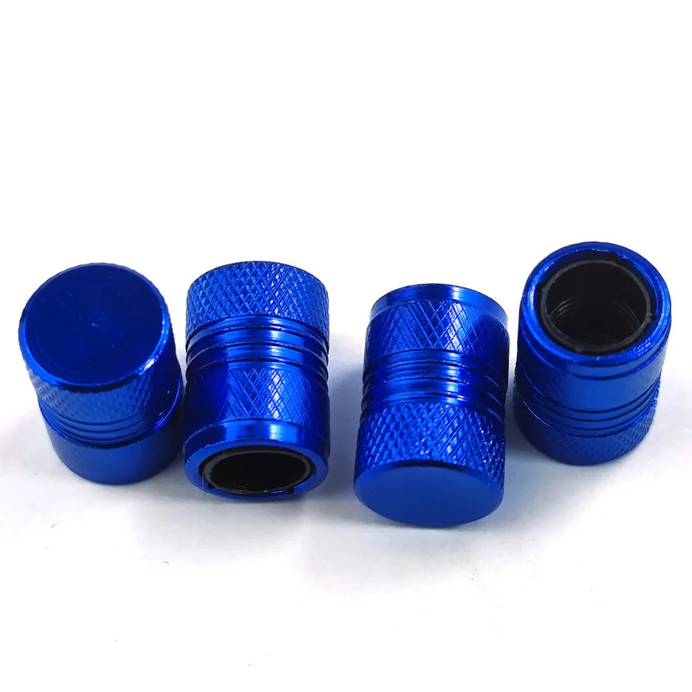 Aluminium car tyre valve dust cap in four colour options: black, blue, grey, and red.