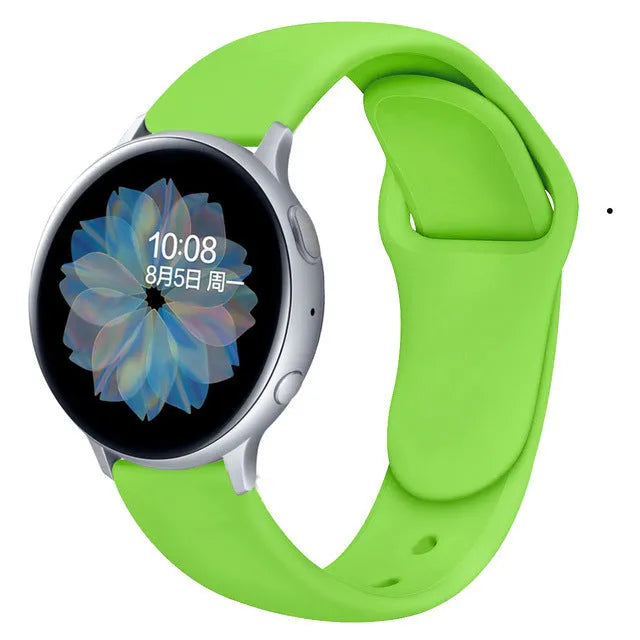 Samsung Galaxy Active 2 watch with a purple reverse buckle silicone strap on a wrist.