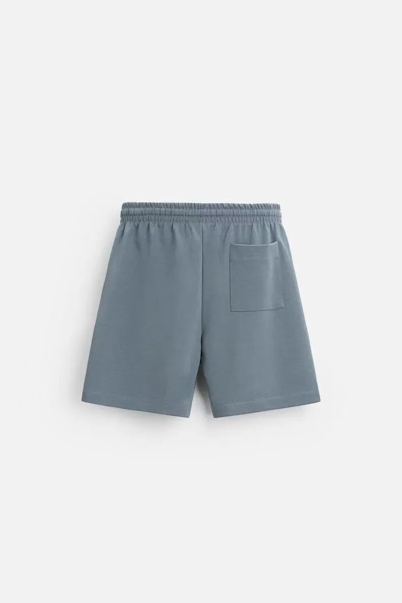 Loose double-sided cloth texture short sleeve shirt and matching shorts casual set on a hanger.