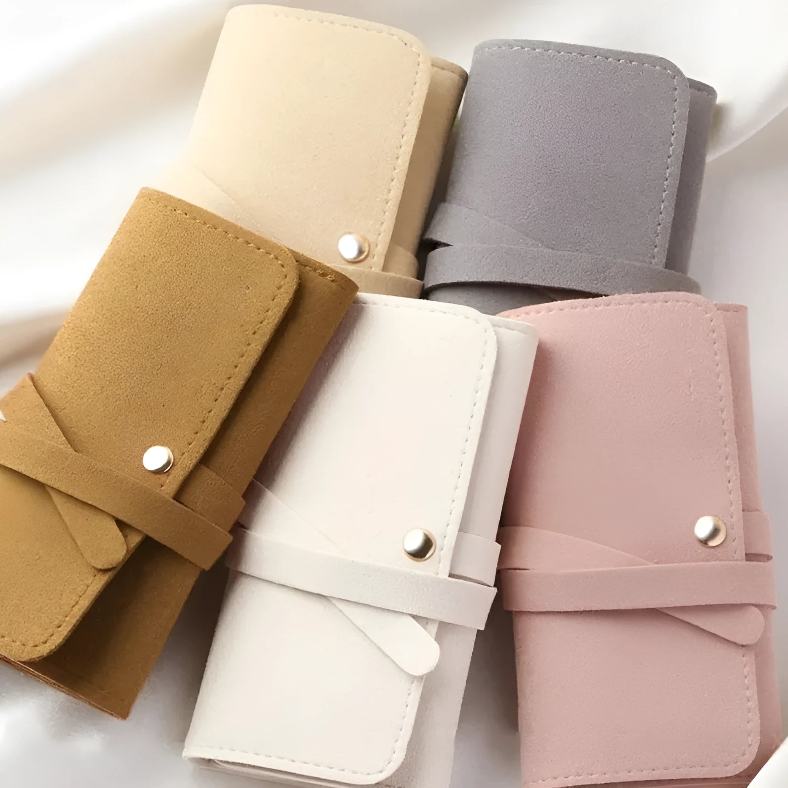 Brown soft microfiber PU leather jewelry storage bag measuring 12x12 cm for earrings and watches.