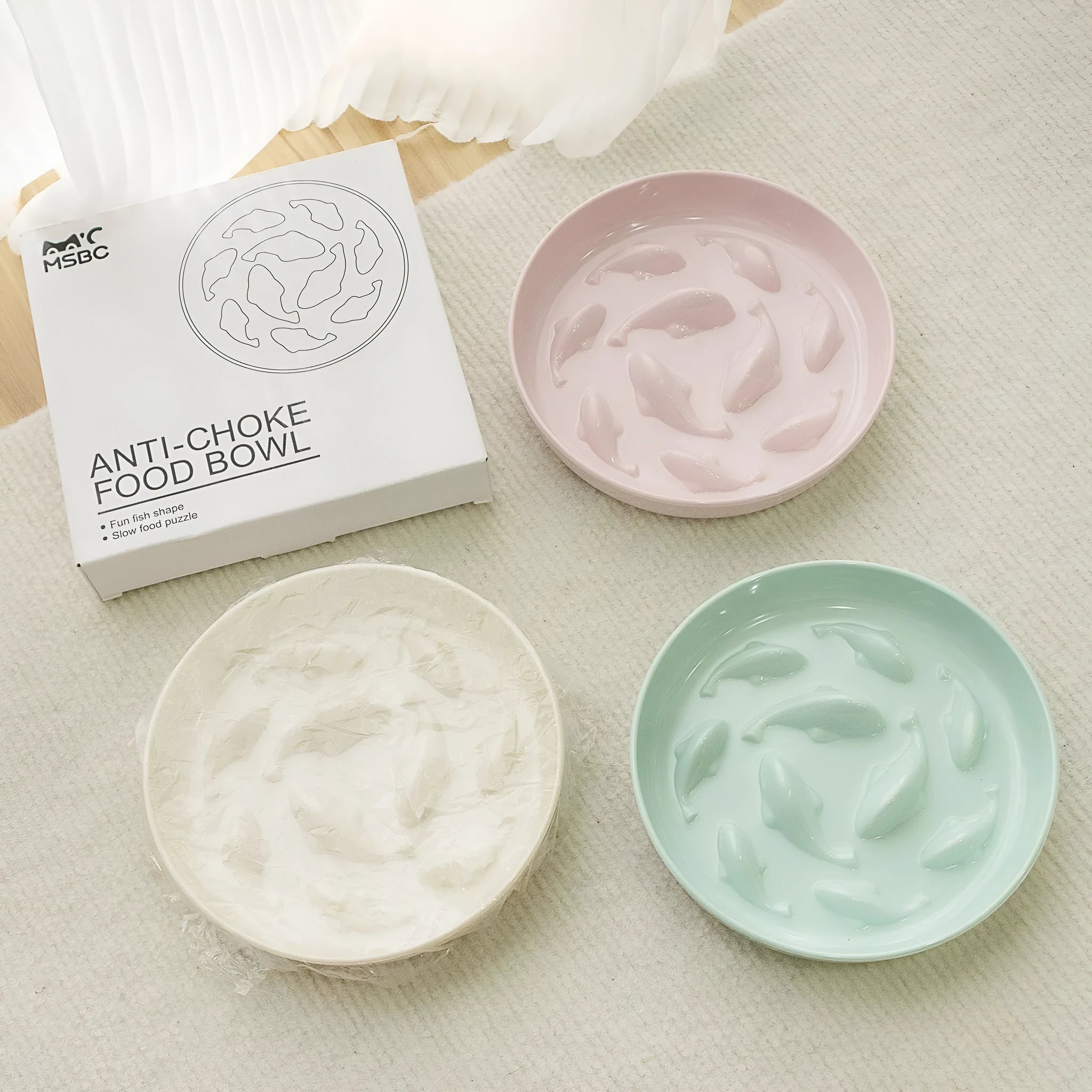 Coloured melamine slow feeding bowl for cats with raised interior pattern