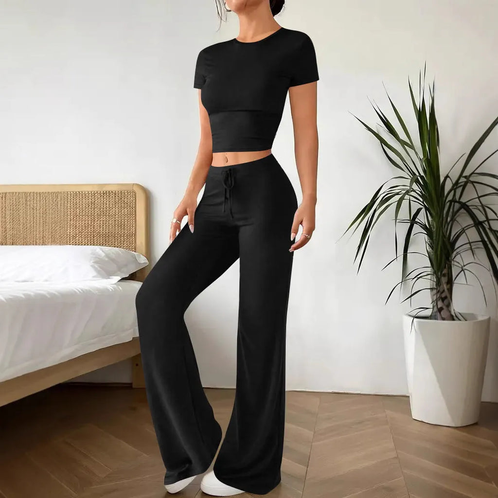 Black high waist trousers and regular sleeve T-shirt co-ordinated suit set.