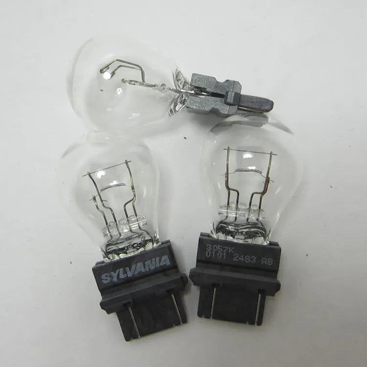 Wagner brake light bulb with dual wire design showing plastic alignment dots and 16mm socket