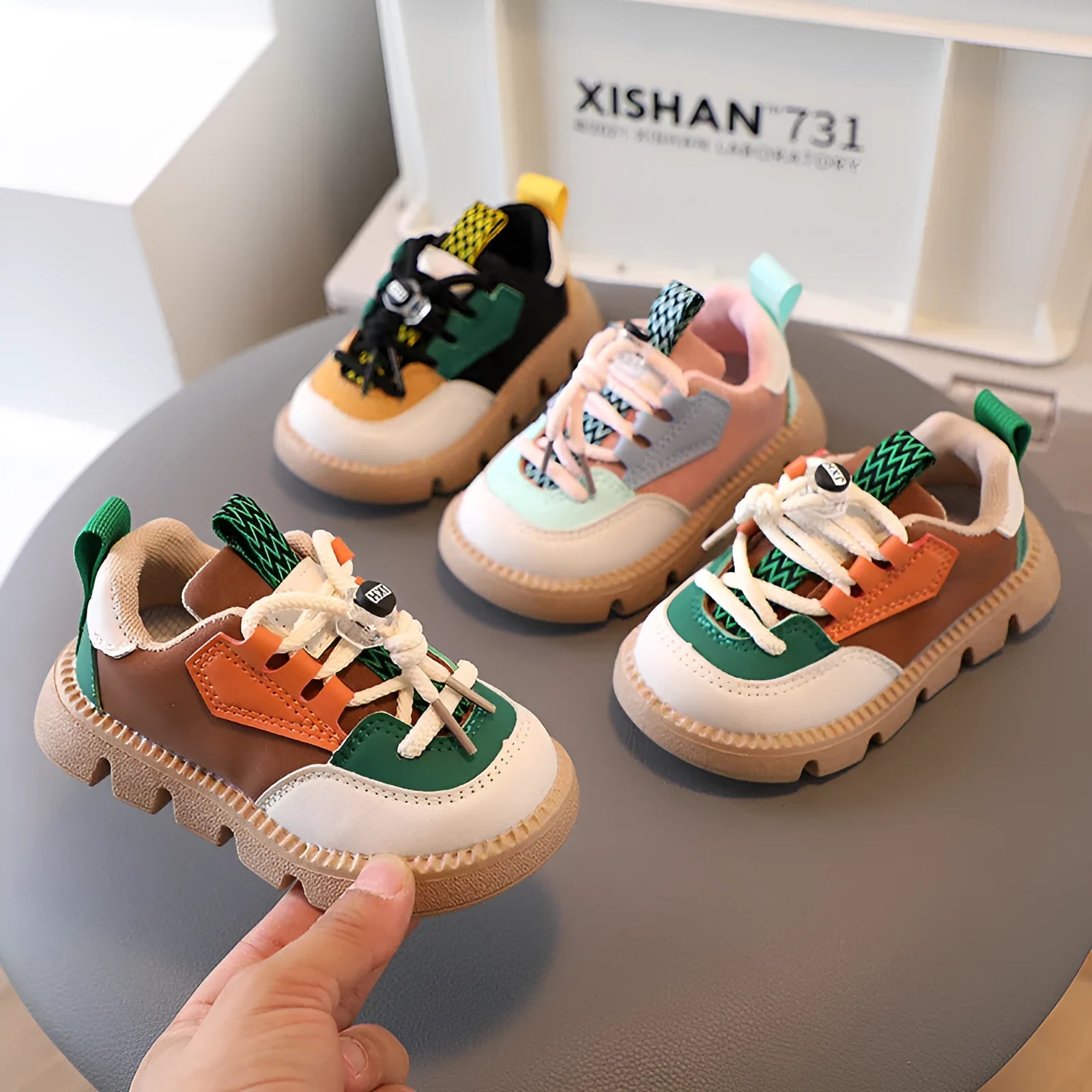 Low-cut PU leather soft-soled toddler shoes in solid colour with Velcro fastening, side view