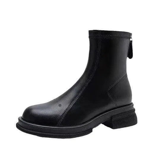 Women's black flat-heel ankle boots with round toe and back zipper.
