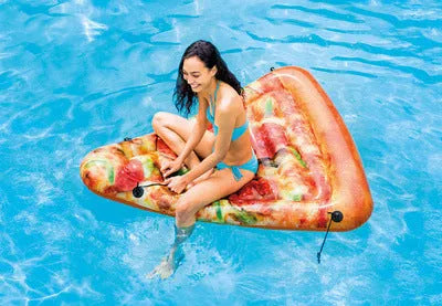 Large inflatable pizza-themed surfboard recliner floating in water