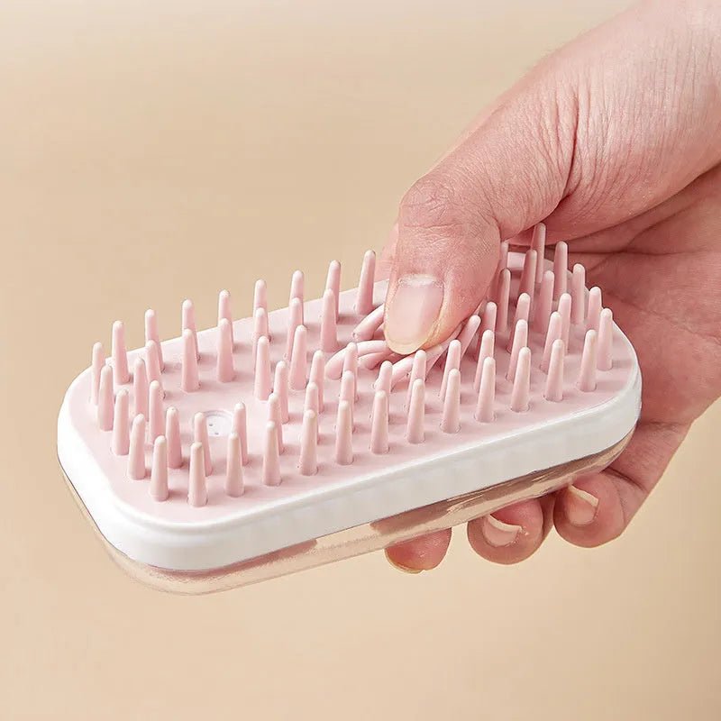 Silicone pet bath brush with soft bristles and ergonomic handle for dogs and cats