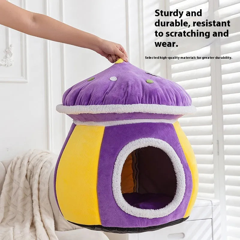 Grey mushroom-shaped enclosed cat bed with plush interior and a detached matching blanket on a wooden floor.