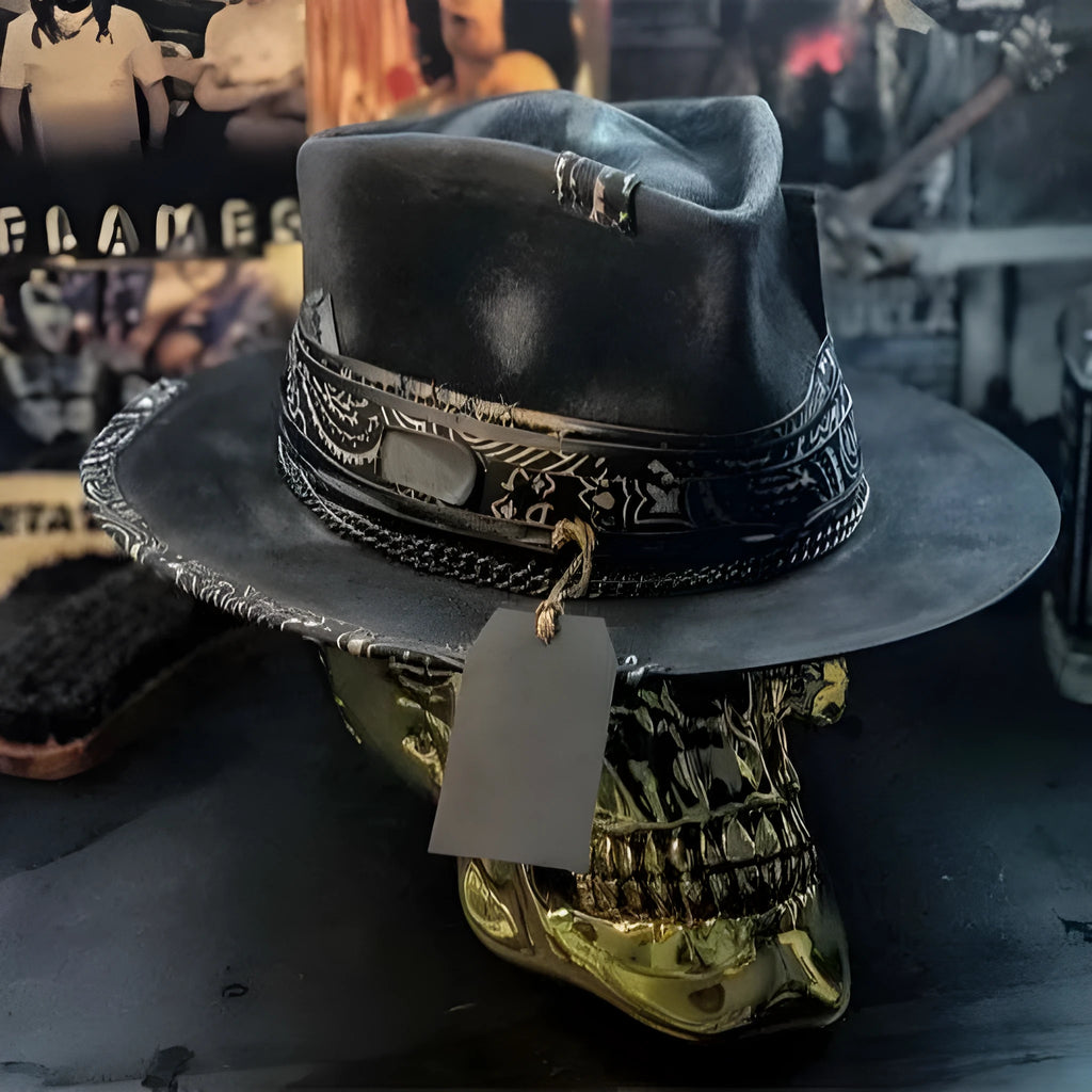 Handmade wool felt conical crown skull hat for Halloween costumes on a dark background.