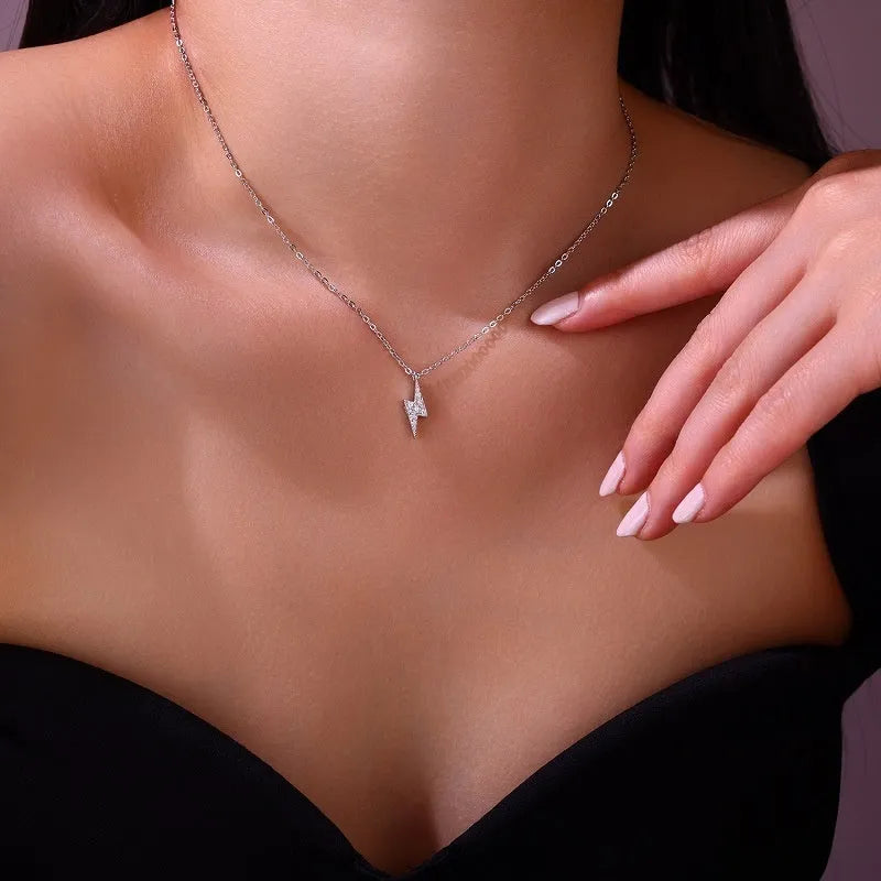 S925 Sterling Silver moissanite necklace with lightning pendant and cross chain on white background