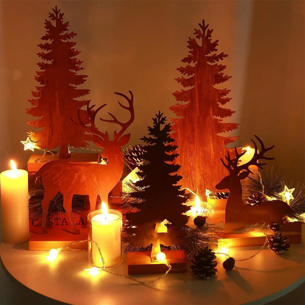 Three metal Christmas tree ornaments with rusty finish featuring elk designs