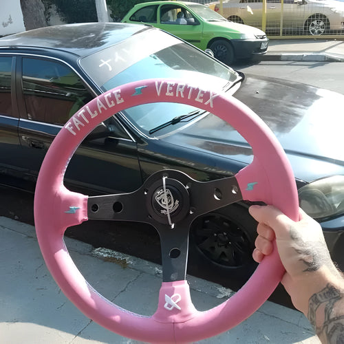 Pink leather steering wheel cover with embroidery, showing aluminium bracket and 13-inch size.