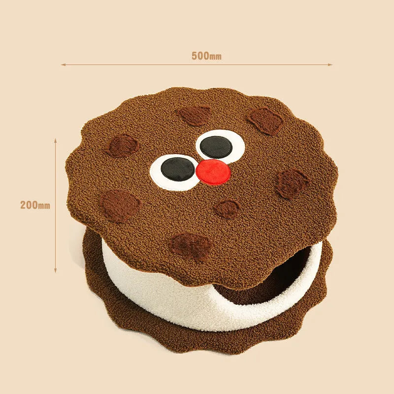 Khaki coloured enclosed cat house shaped like a sandwich cookie nest with a single entry.