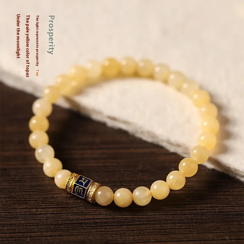 Women's hand-woven topaz bracelet with 6mm mantra barrel beads and square jade charms