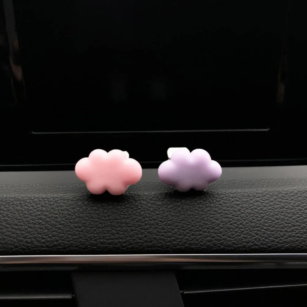 Resin Baiyun cartoon car fragrance clip for air vents in assorted colours.